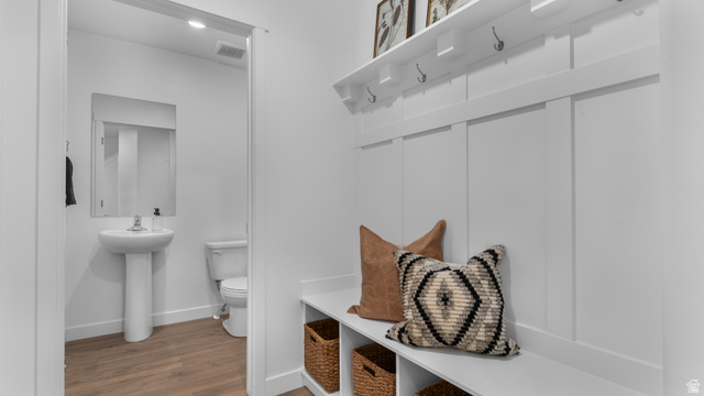 2032 East Dorset Way, Unit 286 Salem, UT 84653 - Photo 4 of 23 Entryway featuring board and batten wall paneling with integrated hooks and a bench seat with lower storage cubbies