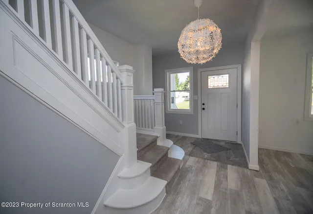 a view of entryway with wooden floor