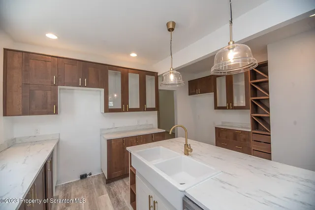 a kitchen with a sink and a refrigerator