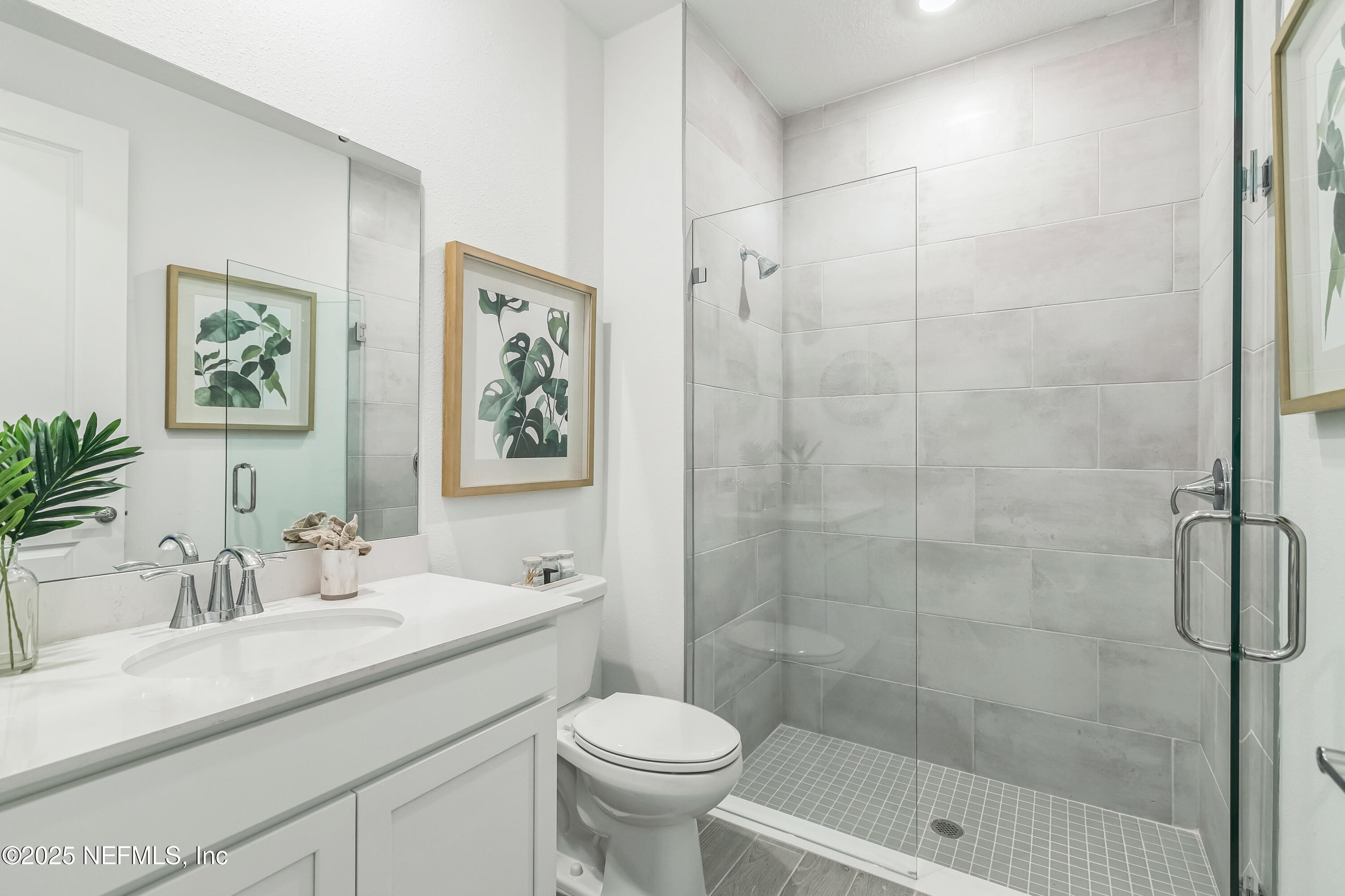 3363 Tupelo Loop Green Cove Springs, FL 32043 - Photo 14 of 26 a bathroom with a sink toilet and shower