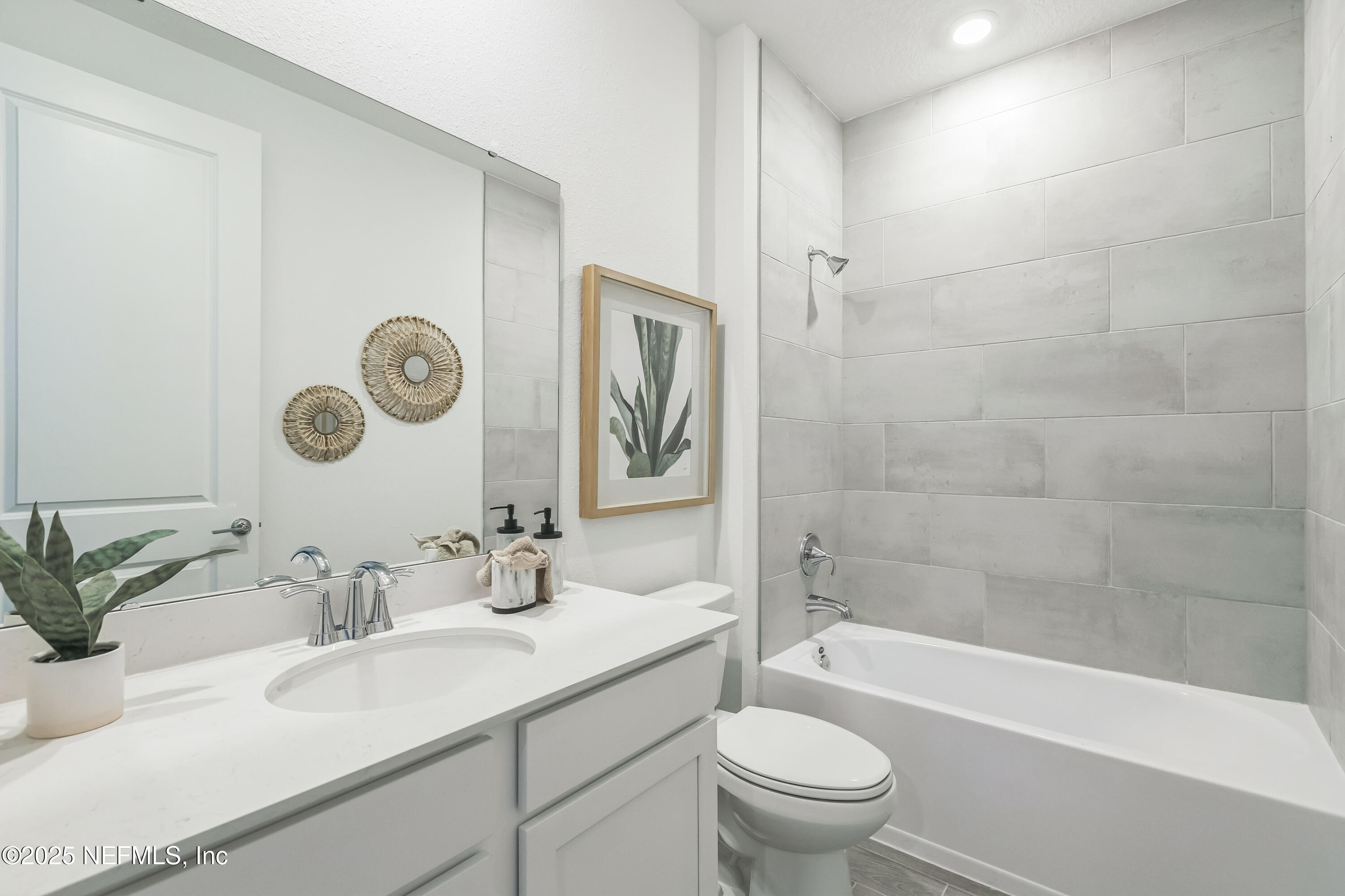 3363 Tupelo Loop Green Cove Springs, FL 32043 - Photo 15 of 26 a bathroom with a sink a toilet and shower