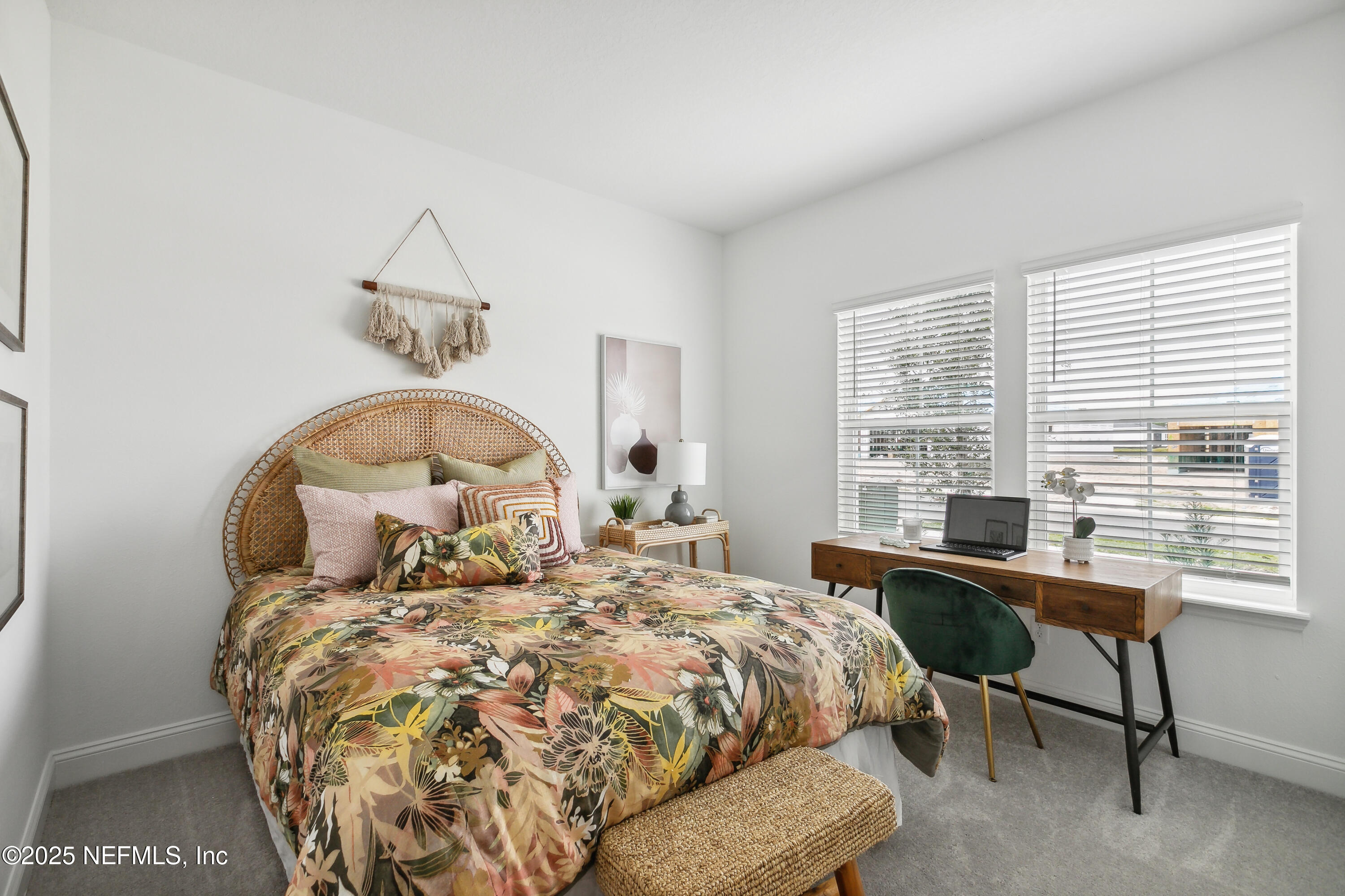 3363 Tupelo Loop Green Cove Springs, FL 32043 - Photo 16 of 26 a bedroom with a bed and a table