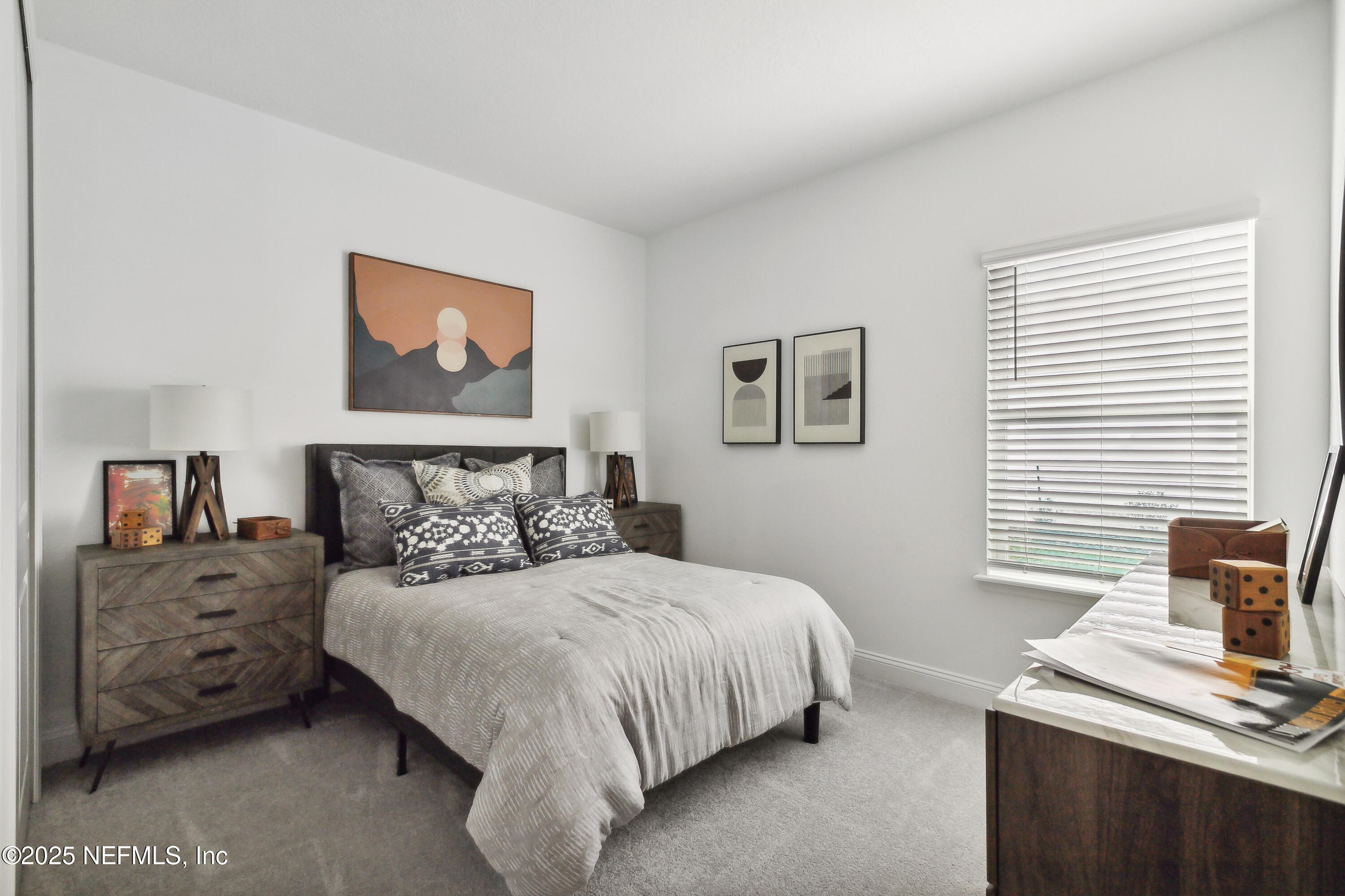 3363 Tupelo Loop Green Cove Springs, FL 32043 - Photo 18 of 26 a bedroom with a bed and a desk