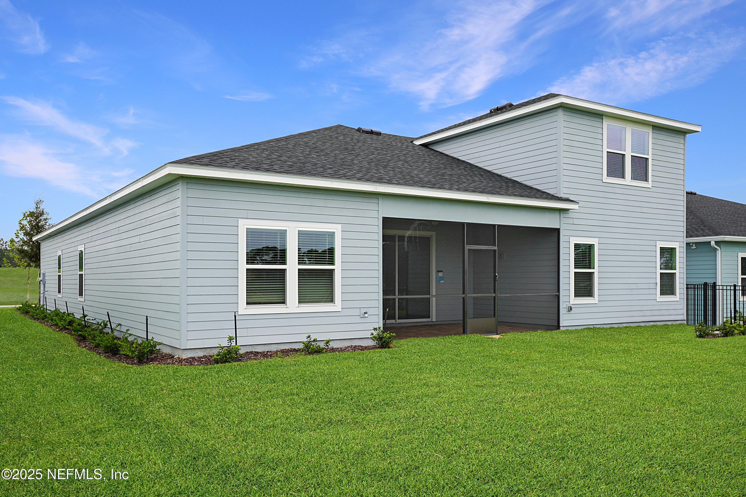3363 Tupelo Loop Green Cove Springs, FL 32043 - Photo 2 of 26 a front view of house with yard and green space