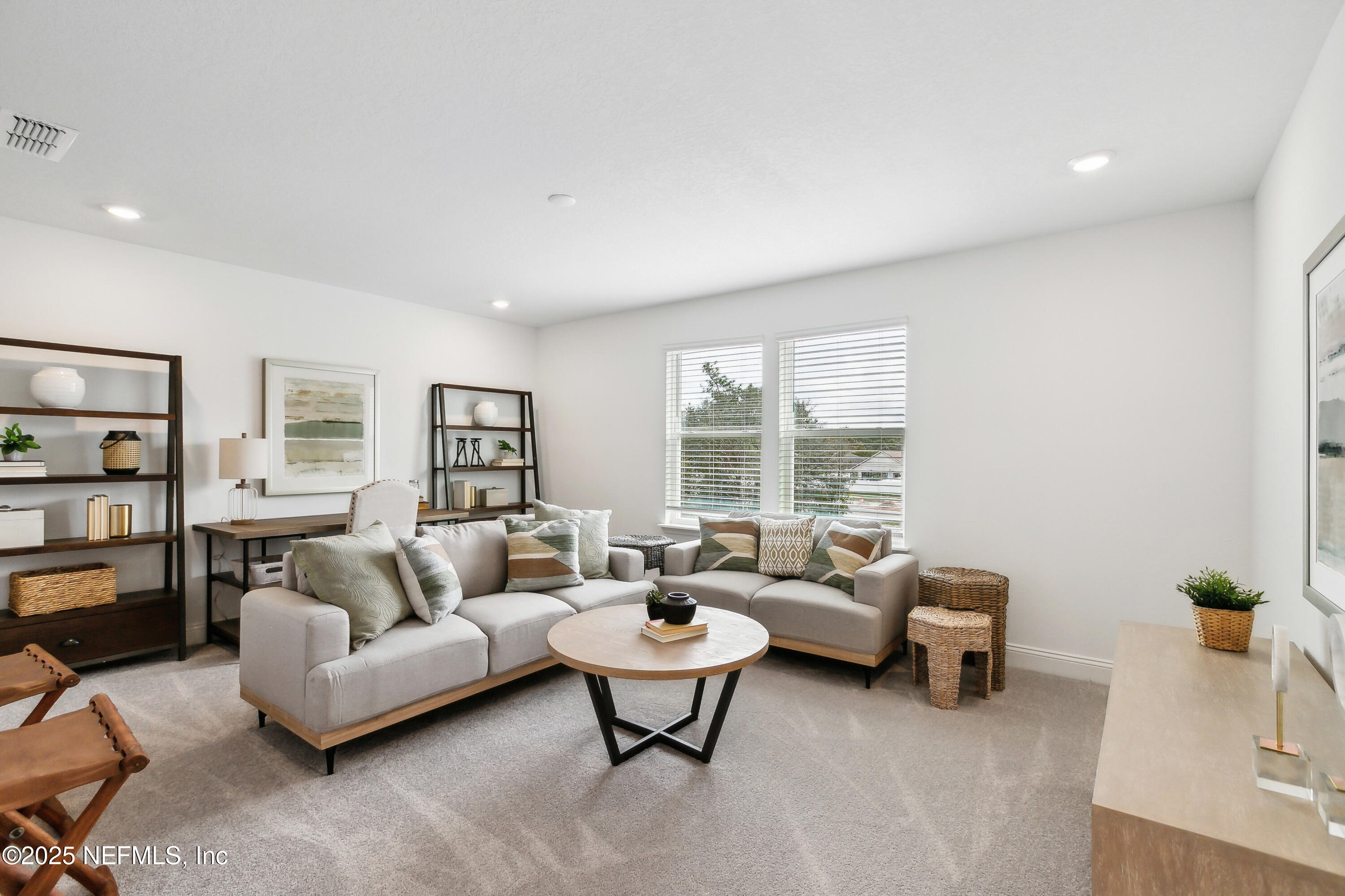 3363 Tupelo Loop Green Cove Springs, FL 32043 - Photo 21 of 26 a living room with furniture and a large window