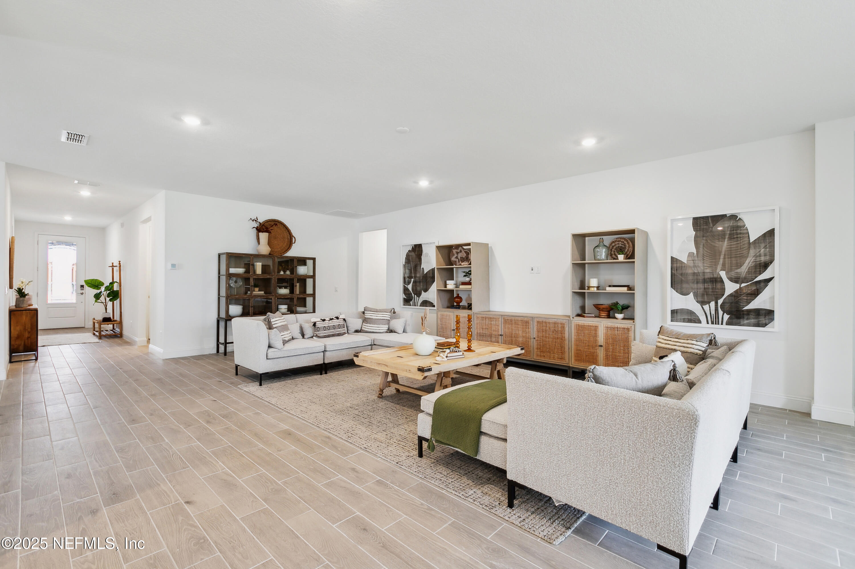 3363 Tupelo Loop Green Cove Springs, FL 32043 - Photo 9 of 26 a living room with furniture and a wooden floor