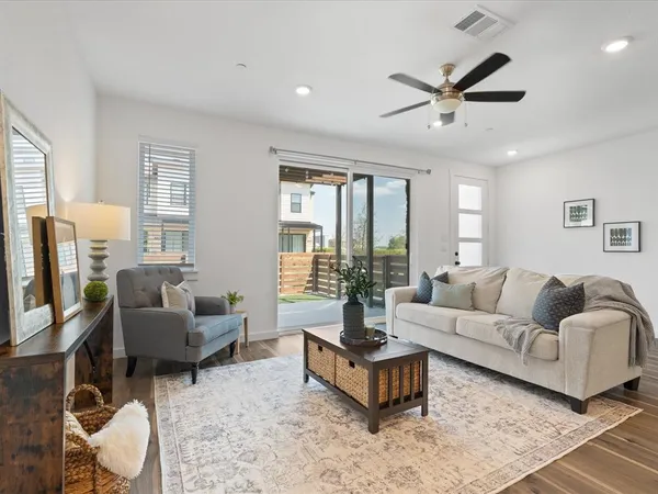 a living room with furniture and a table