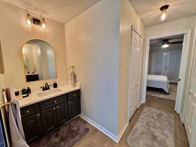 a en suite bathroom with a double vanity sink and a mirror