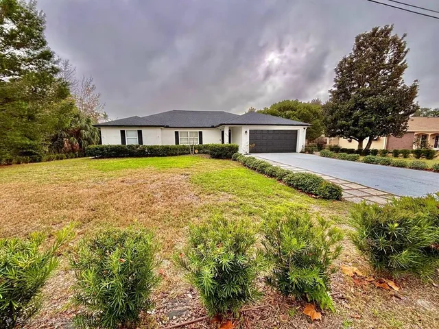 a house view with a garden space