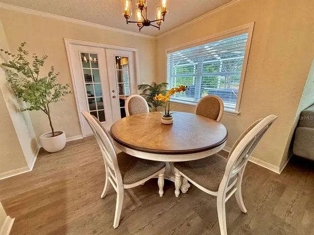 a dining room with furniture and window
