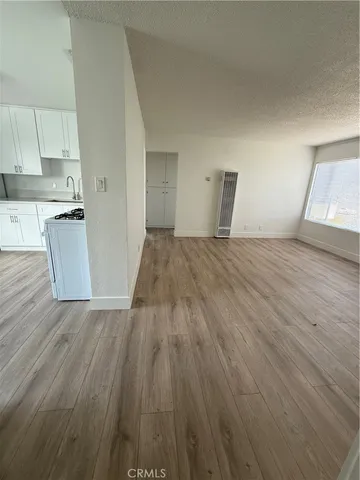 a view of kitchen and wooden floor