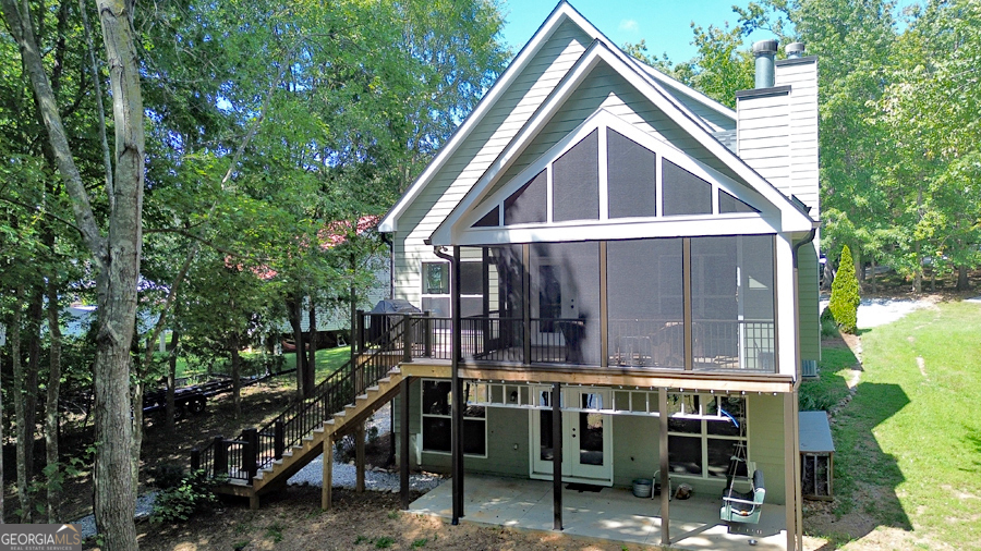 1045 Paynes Creek Road Hartwell, GA 30643 - Photo 11 of 37 a view of house with a small yard and a large tree in it