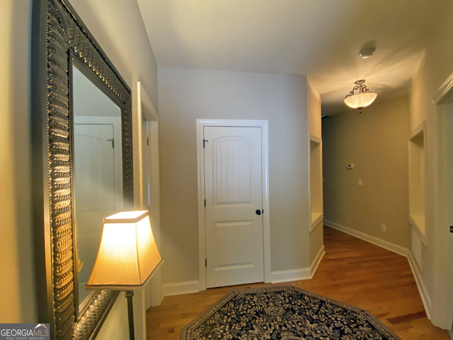 1045 Paynes Creek Road Hartwell, GA 30643 - Photo 12 of 37 a bathroom with a mirror and a shower