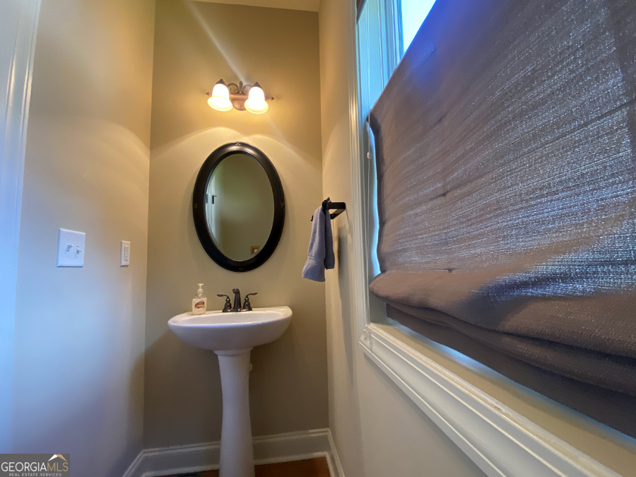 1045 Paynes Creek Road Hartwell, GA 30643 - Photo 16 of 37 a bathroom with a sink and a mirror