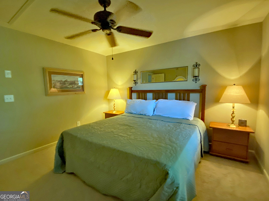 1045 Paynes Creek Road Hartwell, GA 30643 - Photo 17 of 37 a bedroom with a bed and a painting on the wall