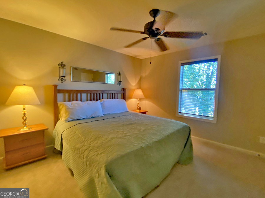 1045 Paynes Creek Road Hartwell, GA 30643 - Photo 18 of 37 a bedroom with a bed and a window