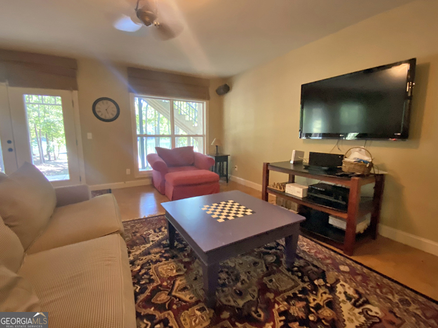 1045 Paynes Creek Road Hartwell, GA 30643 - Photo 23 of 37 a living room with furniture and a flat screen tv