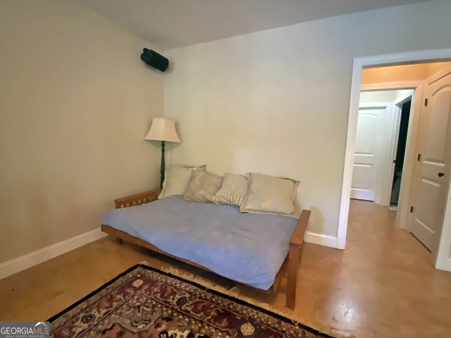 1045 Paynes Creek Road Hartwell, GA 30643 - Photo 24 of 37 a bedroom with a bed and a rug