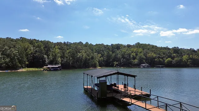 a view of a field with mountains in the background