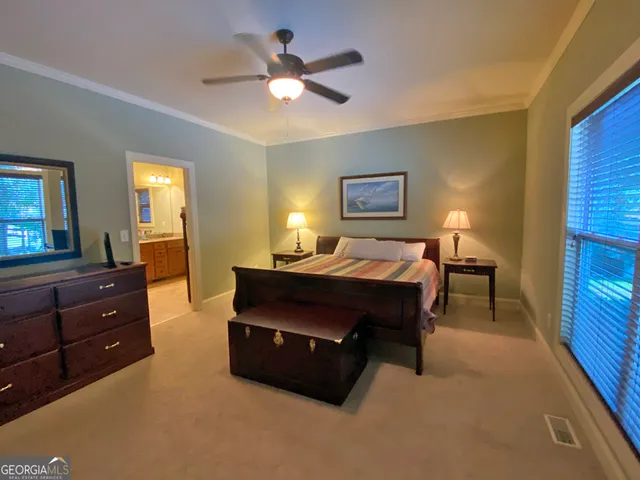 a bed room with a bed and a television