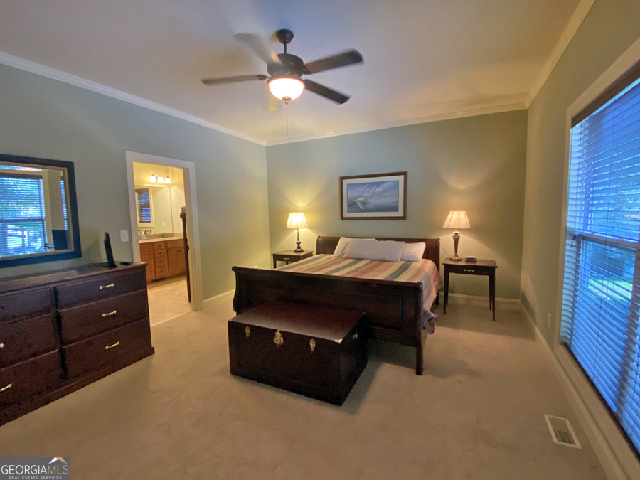1045 Paynes Creek Road Hartwell, GA 30643 - Photo 6 of 37 a bed room with a bed and a television