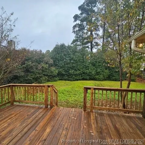 a view of balcony with wooden floor