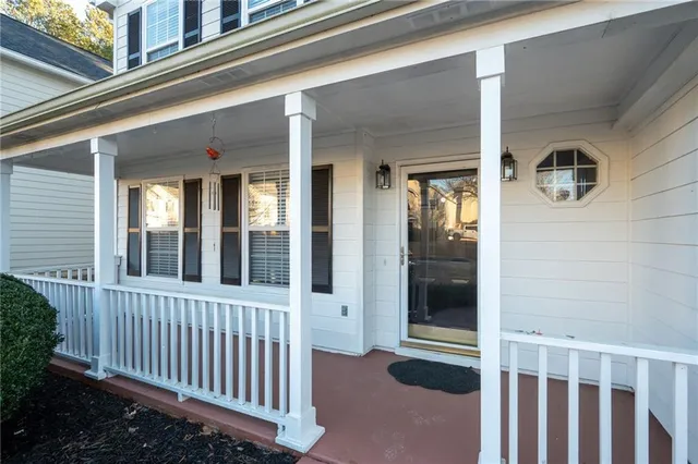 a view of a porch with a table and chair