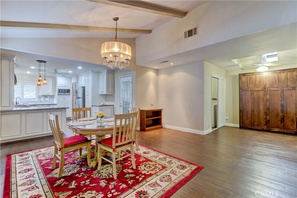 2509 View Lake Santa Ana, CA 92705 - Photo 15 of 74 a view of a dining room with furniture and wooden floor