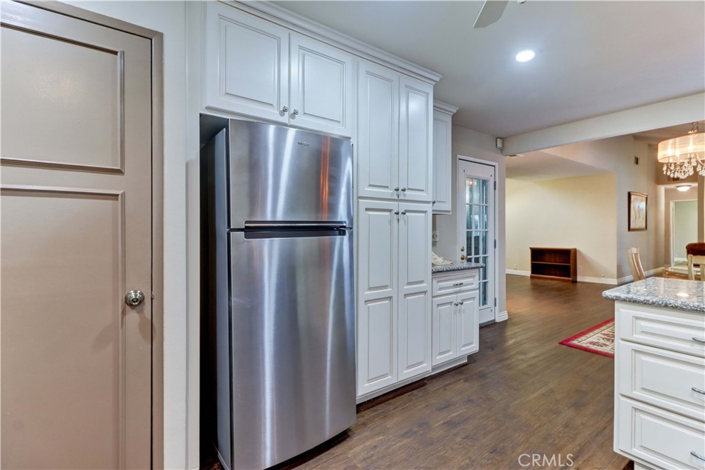 2509 View Lake Santa Ana, CA 92705 - Photo 25 of 74 a kitchen with stainless steel appliances a refrigerator and cabinets