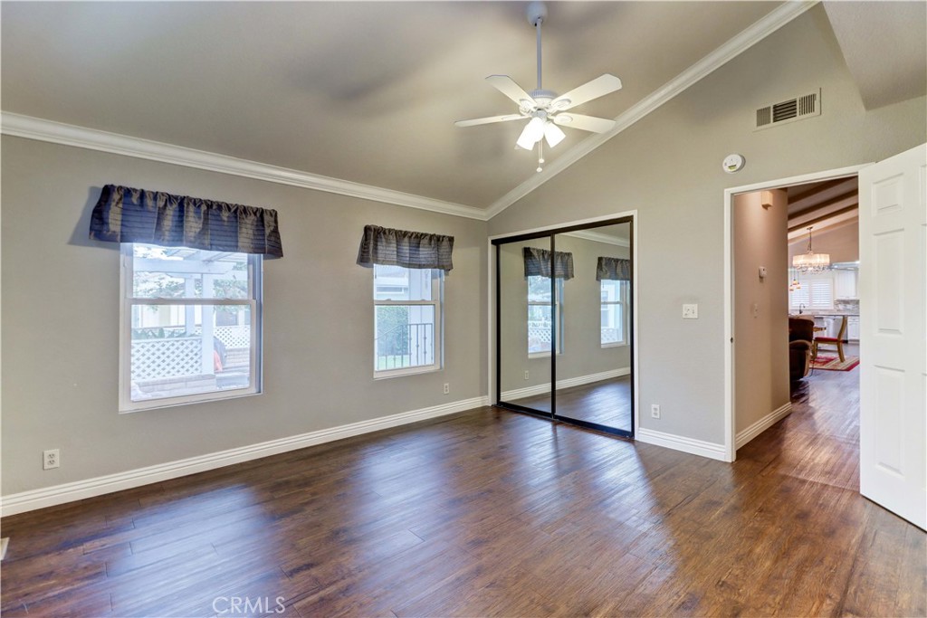 2509 View Lake Santa Ana, CA 92705 - Photo 30 of 74 a view of an empty room with wooden floor and a window