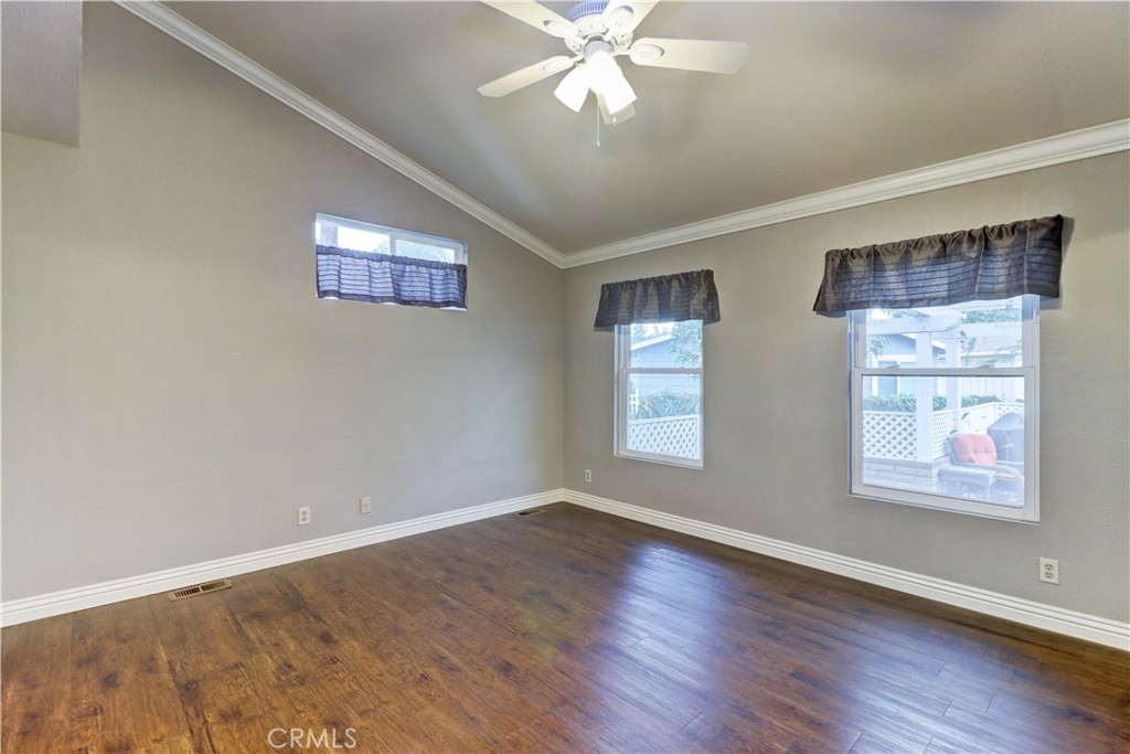 2509 View Lake Santa Ana, CA 92705 - Photo 31 of 74 a view of an empty room with wooden floor and a window