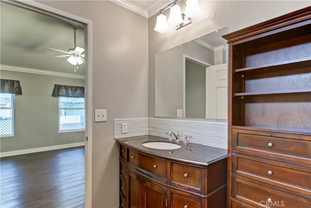 2509 View Lake Santa Ana, CA 92705 - Photo 33 of 74 a bathroom with a sink a light fixture and a mirror