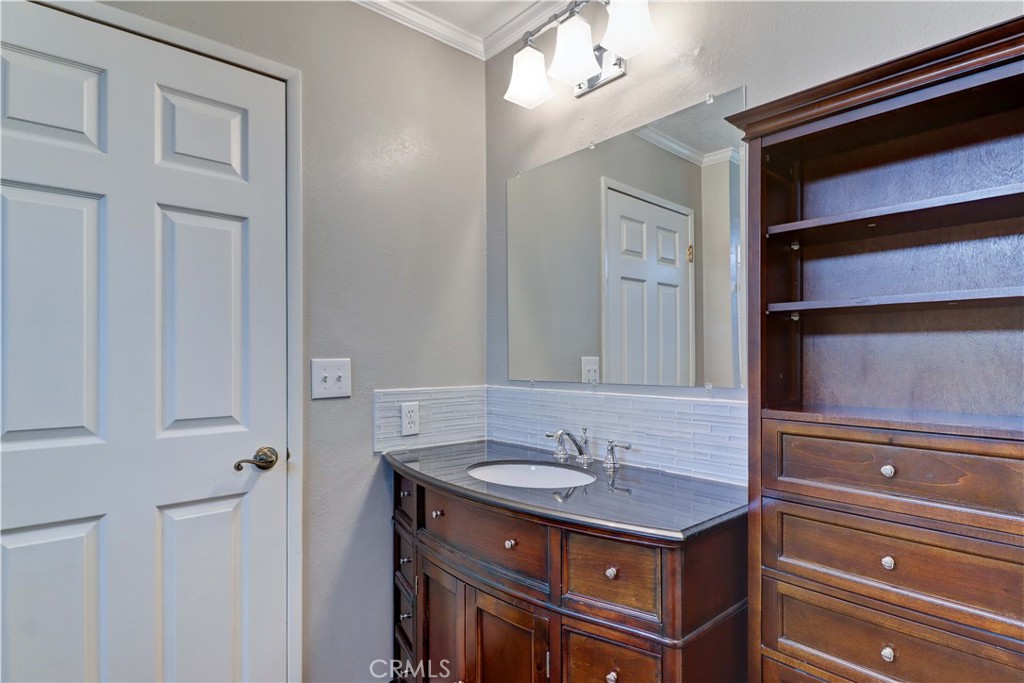 2509 View Lake Santa Ana, CA 92705 - Photo 34 of 74 a bathroom with a sink a vanity and a mirror
