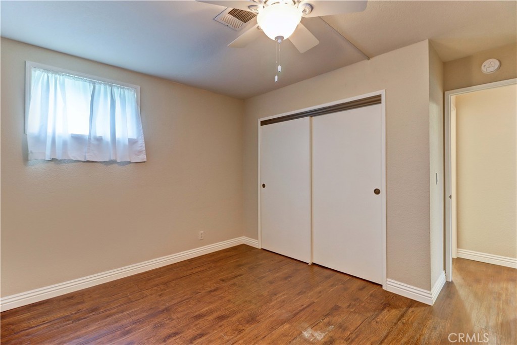 2509 View Lake Santa Ana, CA 92705 - Photo 38 of 74 a view of an empty room with wooden floor and a window