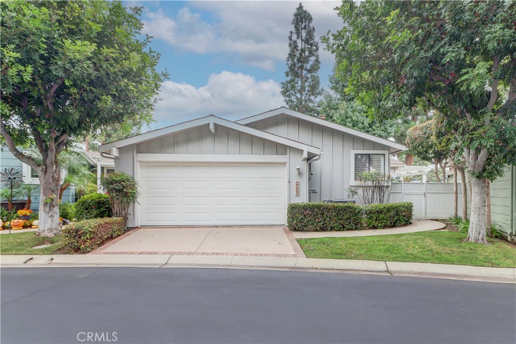 2509 View Lake Santa Ana, CA 92705 - Photo 4 of 74 a front view of a house with a yard and garage