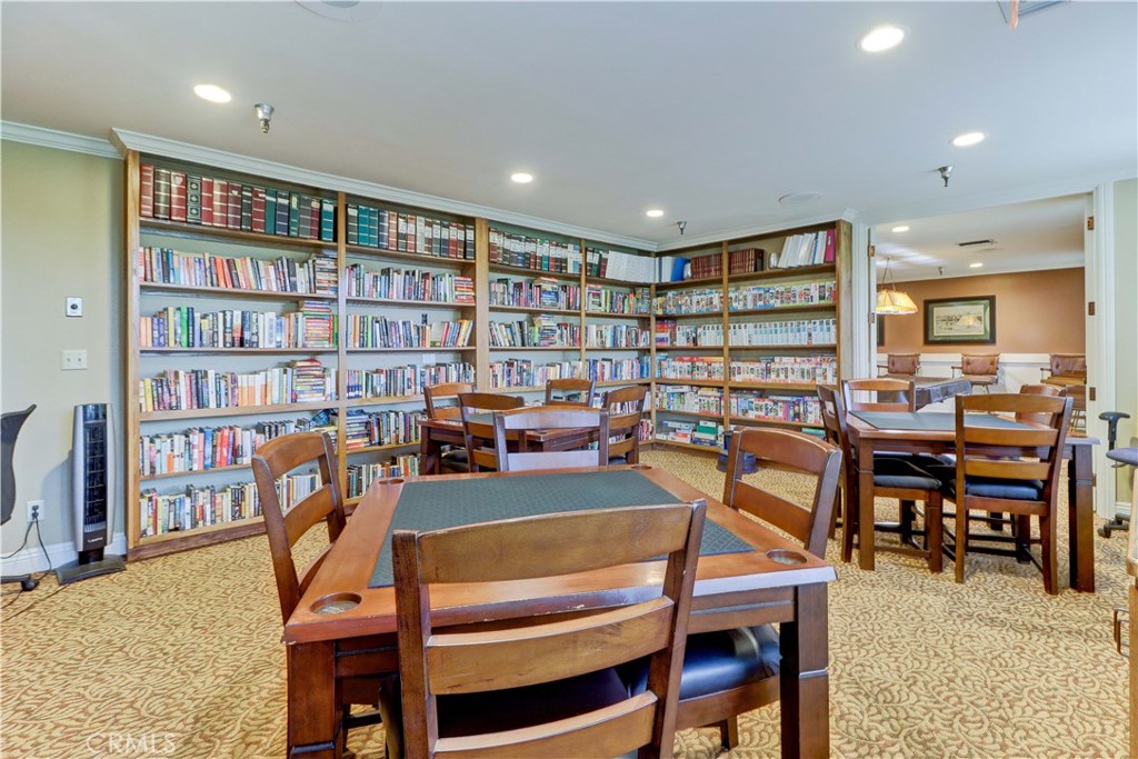 2509 View Lake Santa Ana, CA 92705 - Photo 54 of 74 a dining room with furniture and a book shelf