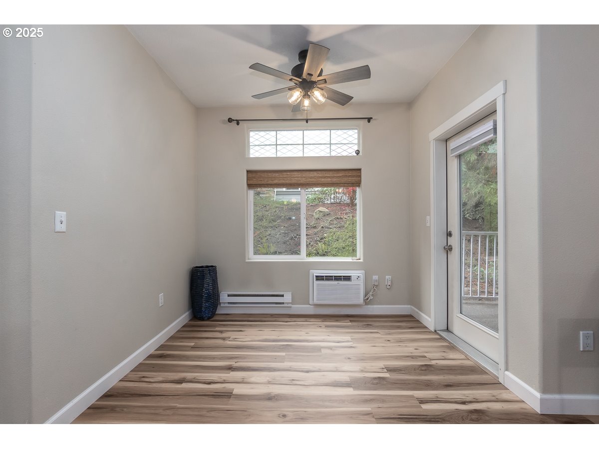 14575 Southwest Magpie Lane, Unit 102 Beaverton, OR 97007 - Photo 17 of 30 a view of an empty room with a window