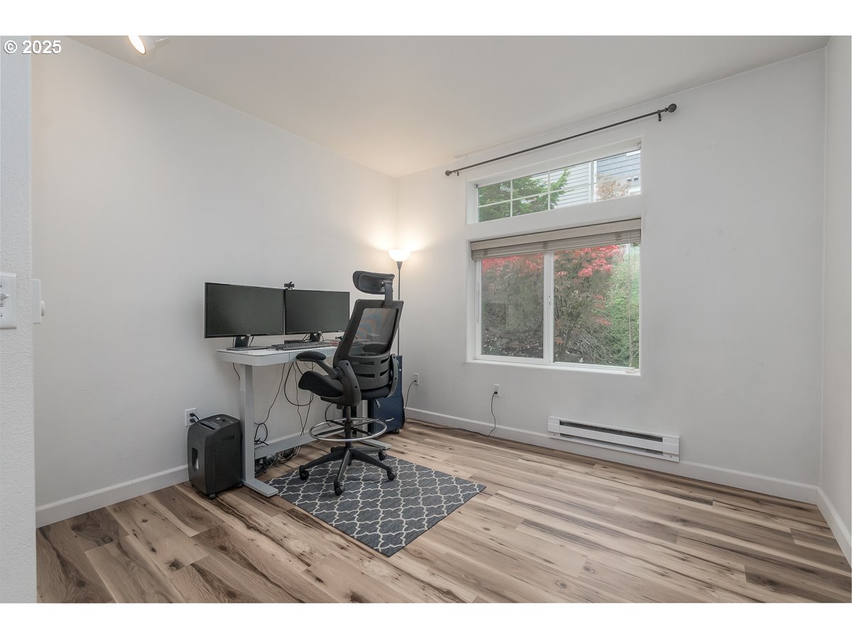 14575 Southwest Magpie Lane, Unit 102 Beaverton, OR 97007 - Photo 18 of 30 a view of a workspace with furniture and a window