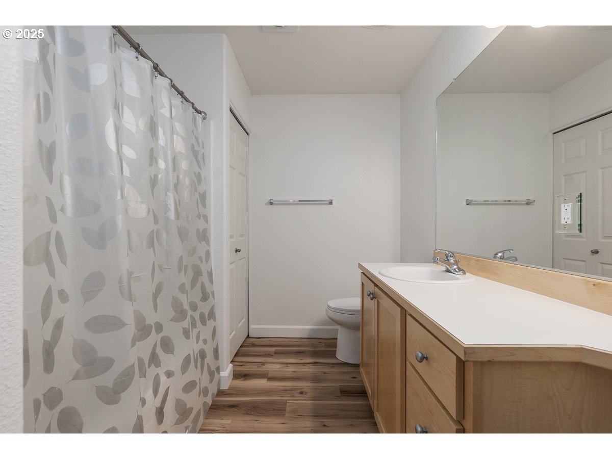 14575 Southwest Magpie Lane, Unit 102 Beaverton, OR 97007 - Photo 20 of 30 a bathroom with a sink and a mirror