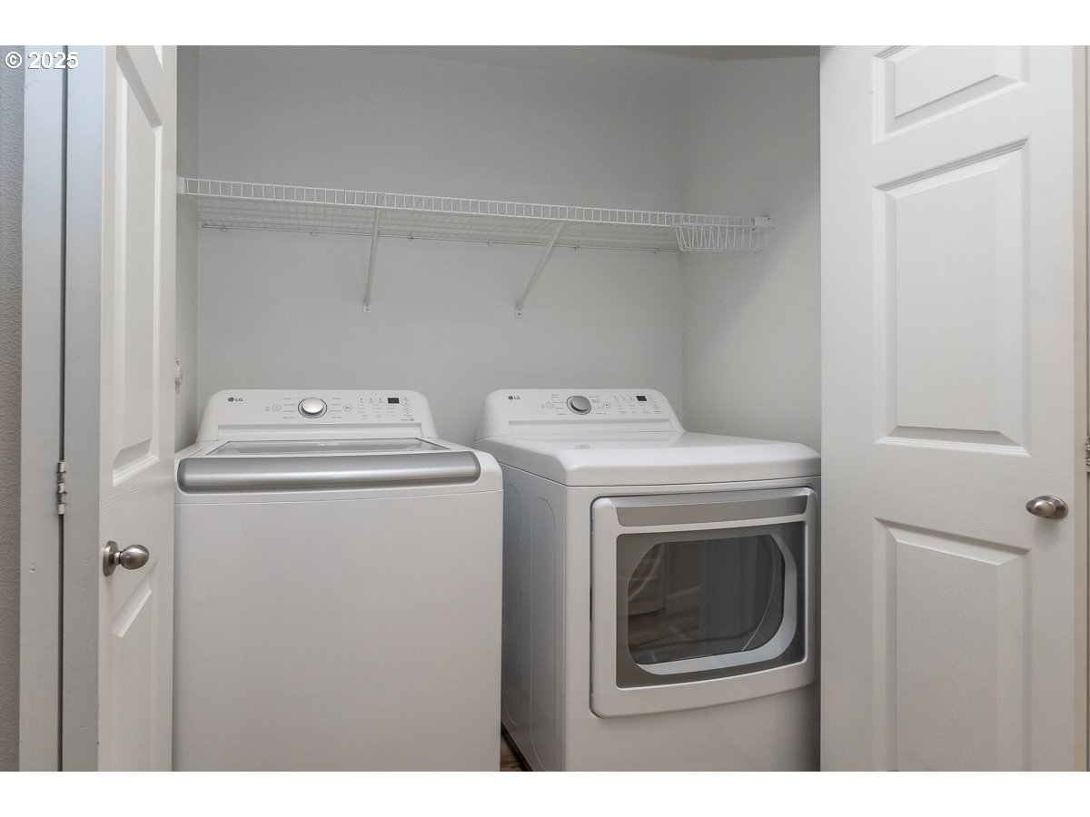14575 Southwest Magpie Lane, Unit 102 Beaverton, OR 97007 - Photo 22 of 30 a utility room with dryer and washer