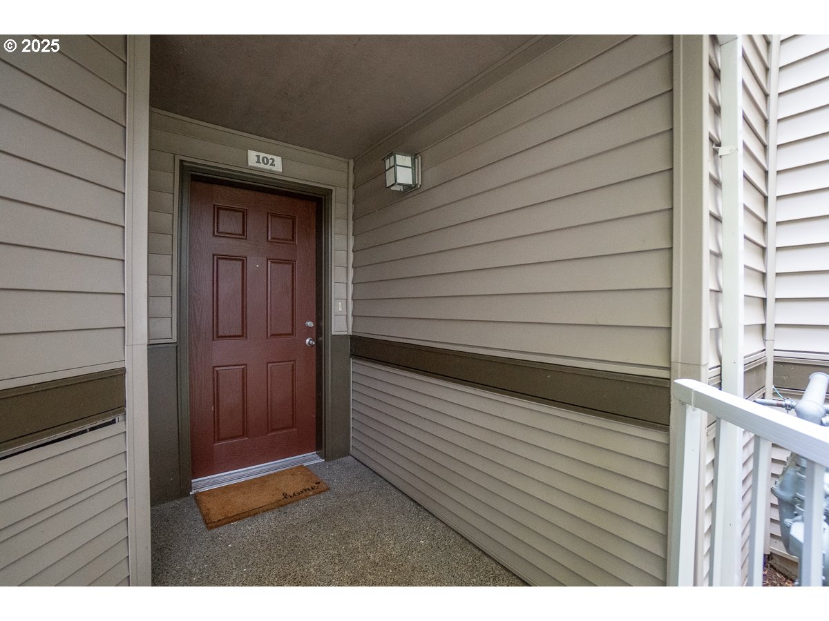 14575 Southwest Magpie Lane, Unit 102 Beaverton, OR 97007 - Photo 4 of 30 a view of wooden door