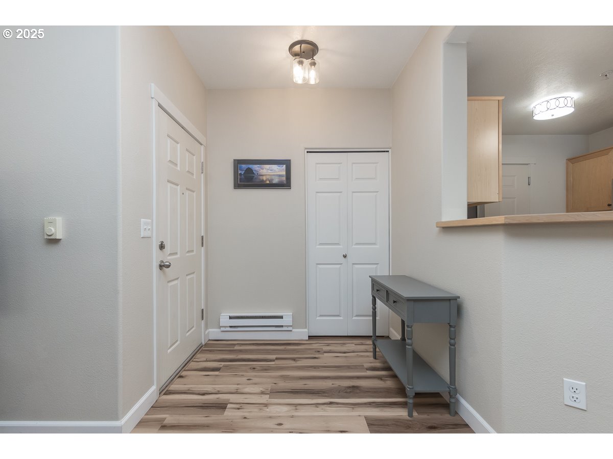 14575 Southwest Magpie Lane, Unit 102 Beaverton, OR 97007 - Photo 5 of 30 a view of a livingroom and hardwood floor