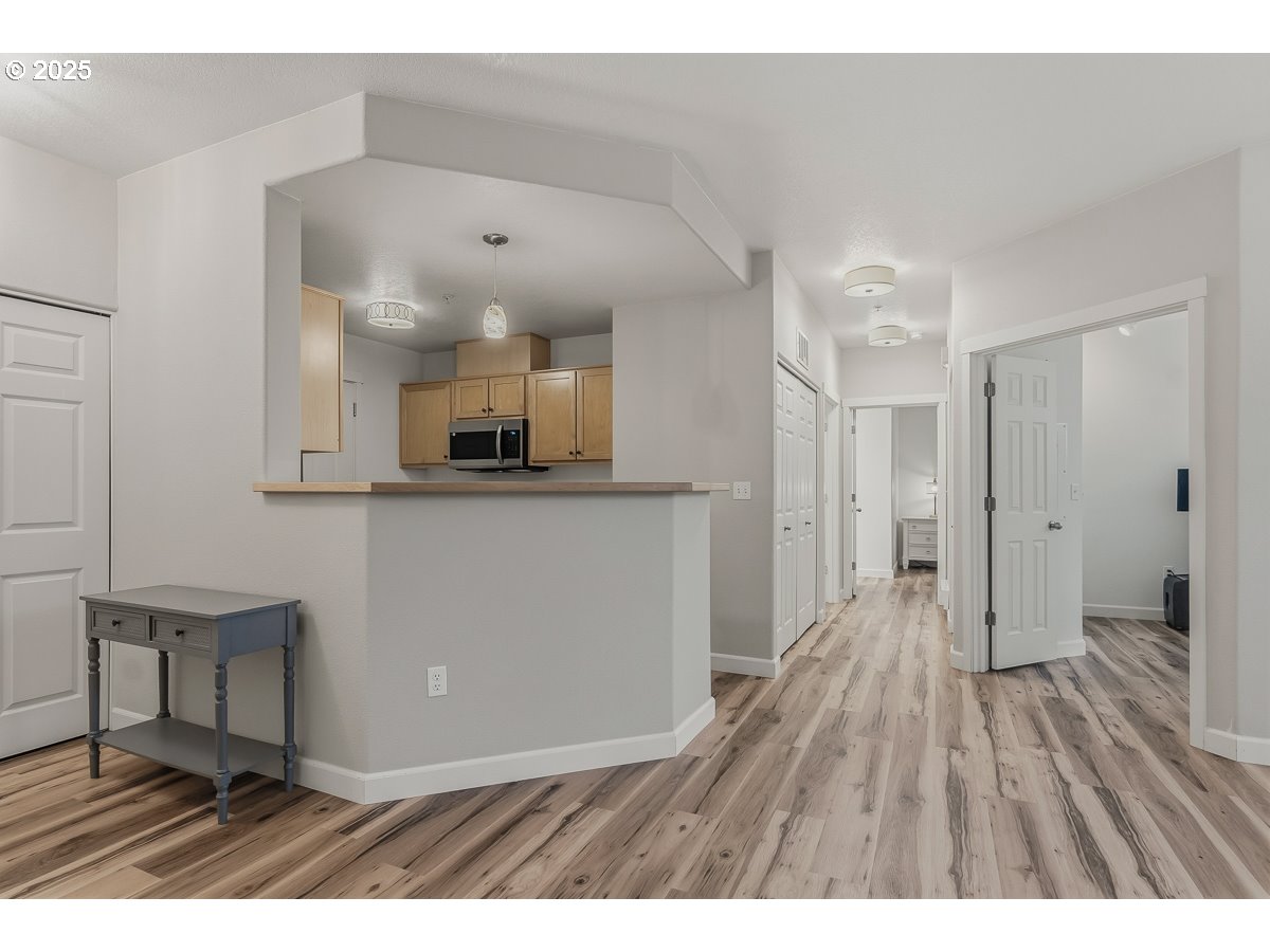 14575 Southwest Magpie Lane, Unit 102 Beaverton, OR 97007 - Photo 6 of 30 a view interior of a house with wooden floor
