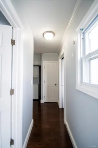 a view of hallway with wooden floor