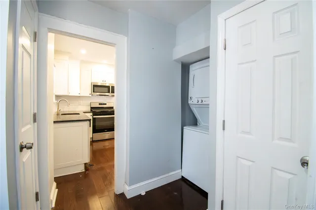 a kitchen with a refrigerator and a stove