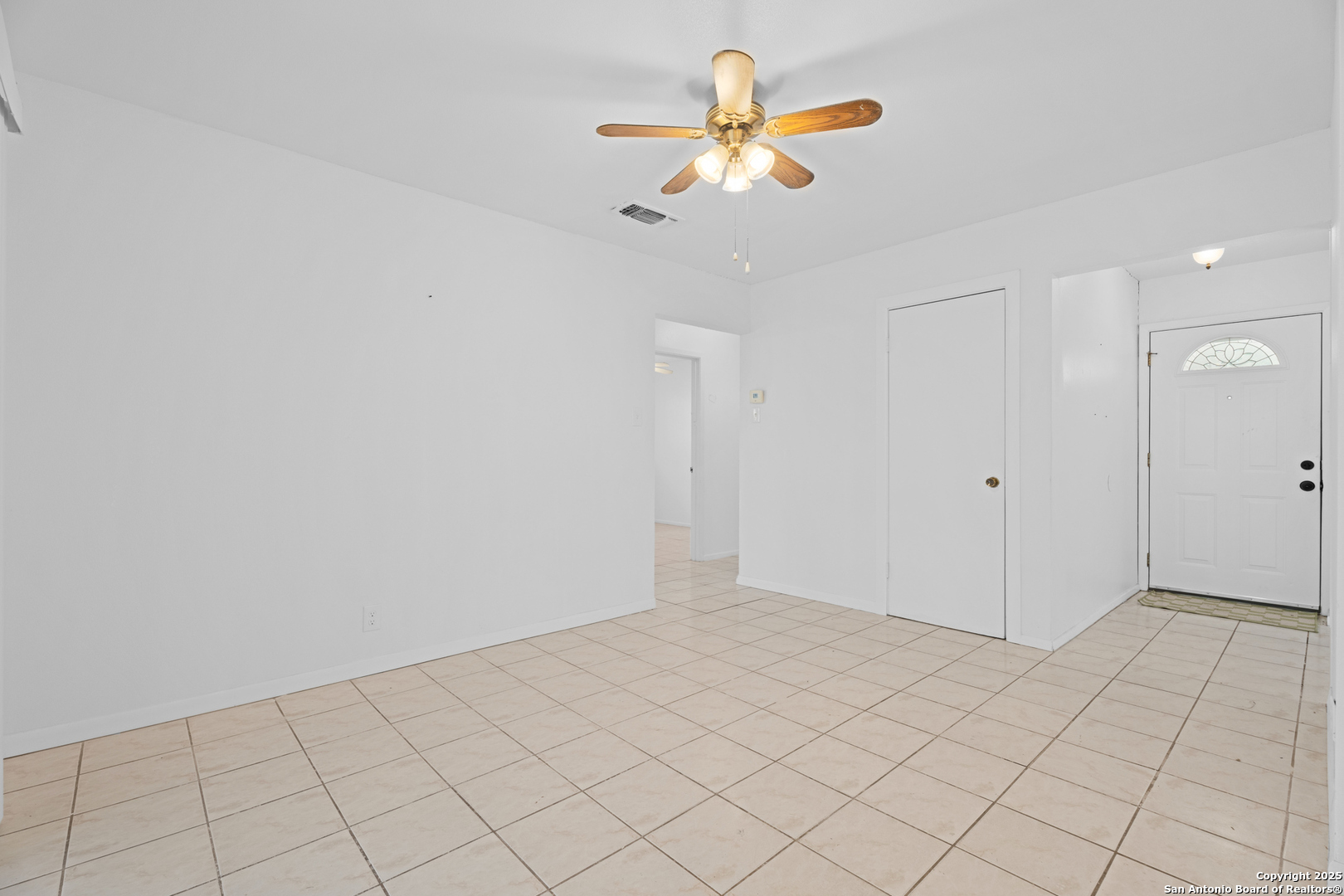 4427 First View Drive San Antonio, TX 78217 - Photo 11 of 26 an empty room with a ceiling fan and window