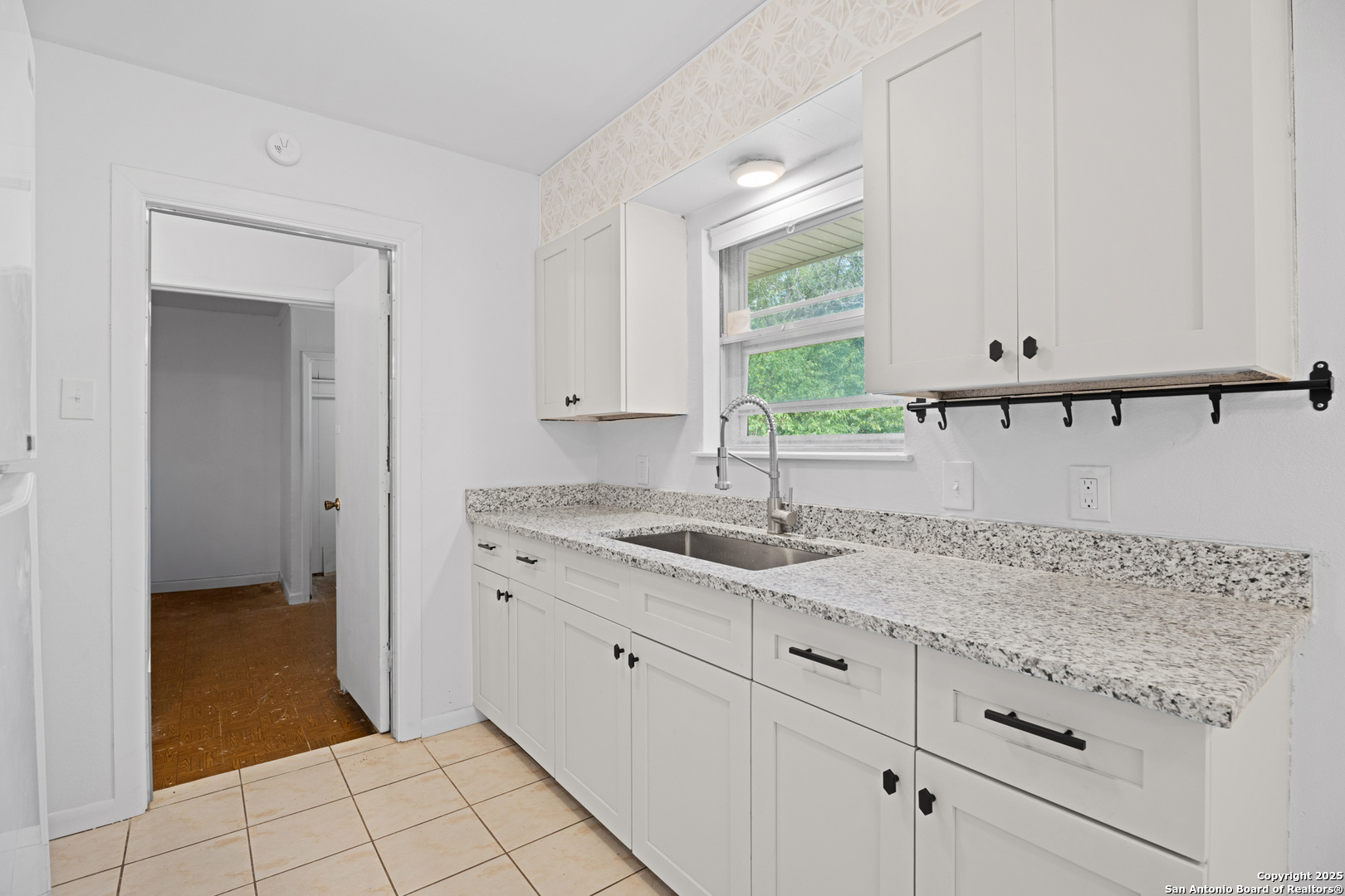 4427 First View Drive San Antonio, TX 78217 - Photo 12 of 26 a bathroom with a granite countertop sink and a mirror
