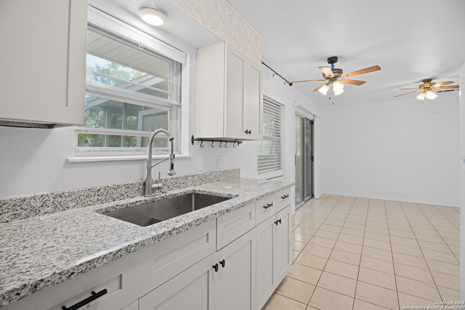 4427 First View Drive San Antonio, TX 78217 - Photo 14 of 26 a kitchen with a sink and cabinets