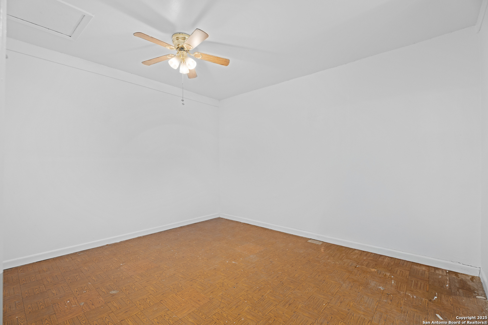 4427 First View Drive San Antonio, TX 78217 - Photo 21 of 26 an empty room with a window and a ceiling fan