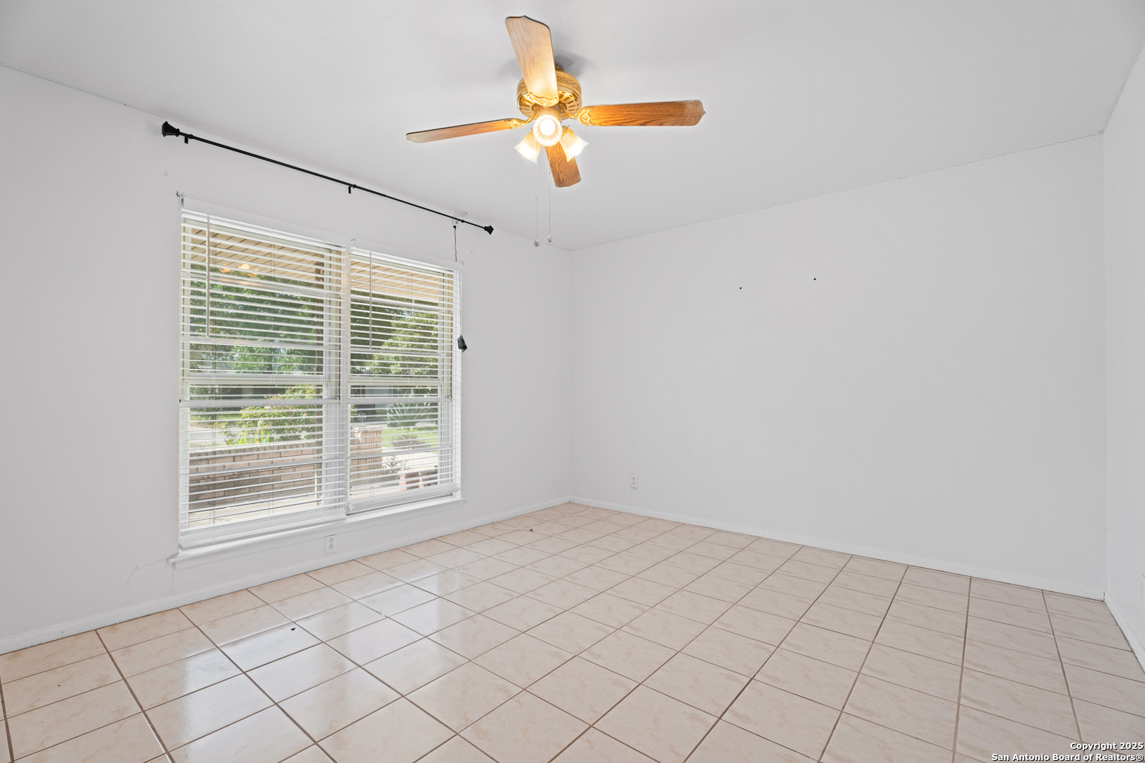 4427 First View Drive San Antonio, TX 78217 - Photo 7 of 26 a view of an empty room with a window